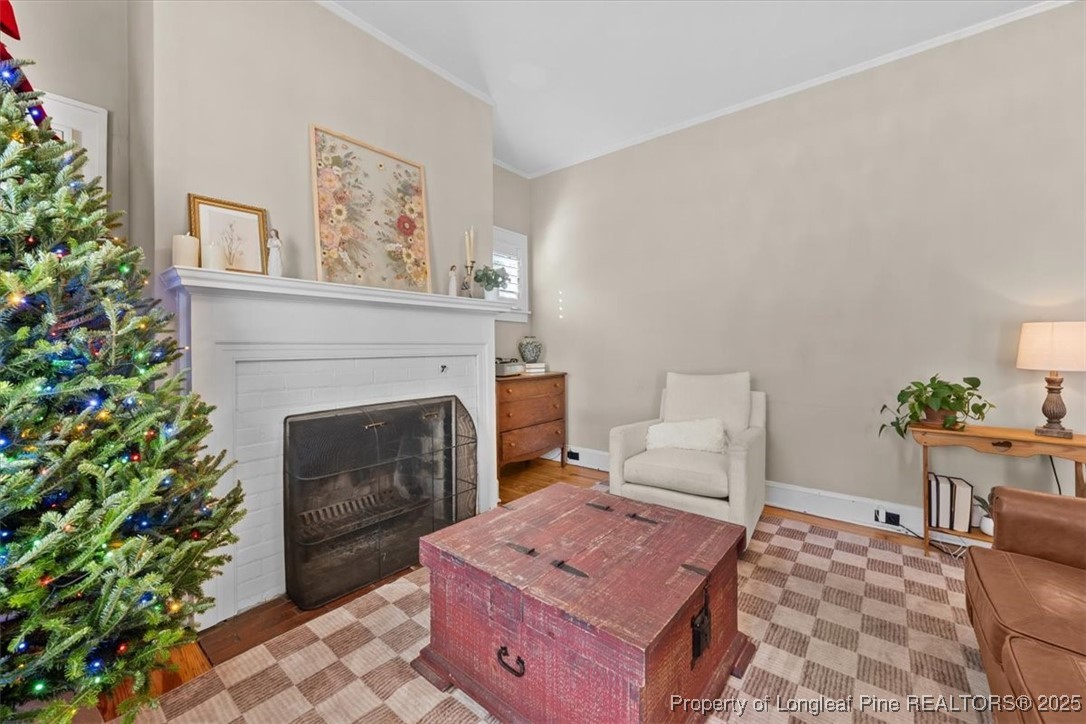 440 Kensington Road Southern Pines, NC 28387 - Photo 16 of 50 a living room with furniture and a fireplace