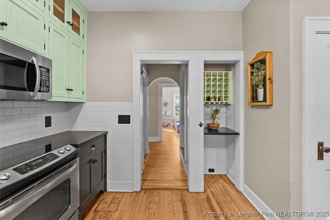 440 Kensington Road Southern Pines, NC 28387 - Photo 18 of 50 a kitchen with a sink a stove and cabinets