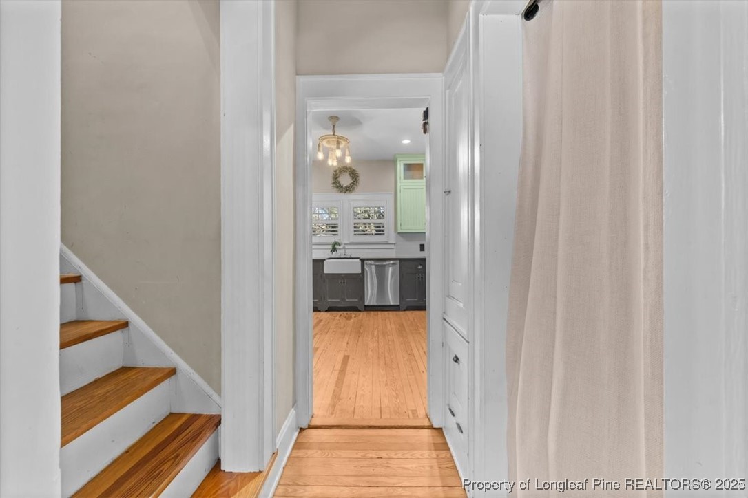 440 Kensington Road Southern Pines, NC 28387 - Photo 19 of 50 a view of a hallway with wooden floor and staircase