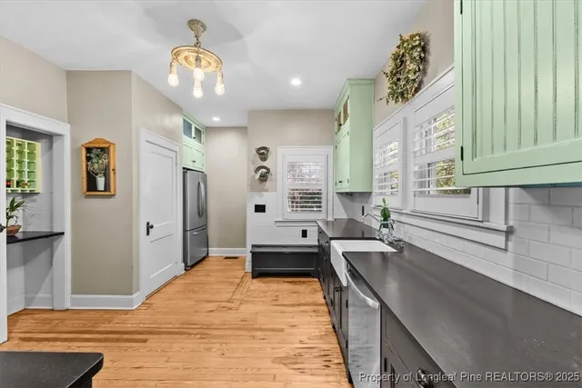 a kitchen with stainless steel appliances granite countertop a stove and a sink
