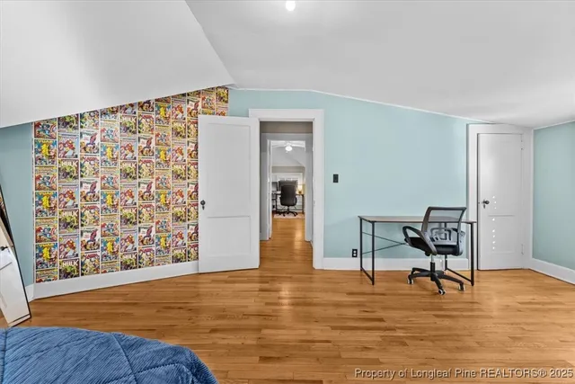a living room with furniture rug and a window
