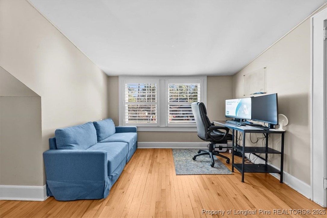 440 Kensington Road Southern Pines, NC 28387 - Photo 33 of 50 a living room with furniture rug and a window