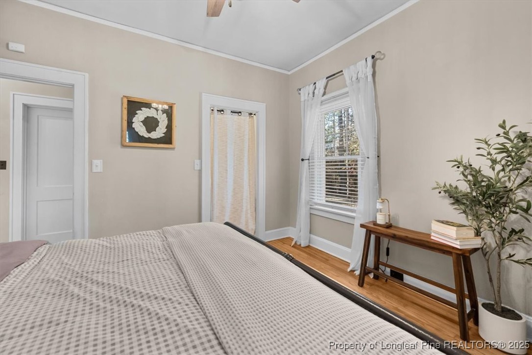 440 Kensington Road Southern Pines, NC 28387 - Photo 36 of 50 a bedroom with a bed and a window