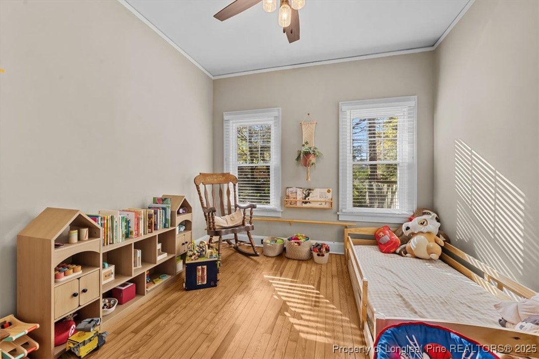 440 Kensington Road Southern Pines, NC 28387 - Photo 40 of 50 a bed room with a bed and a couch