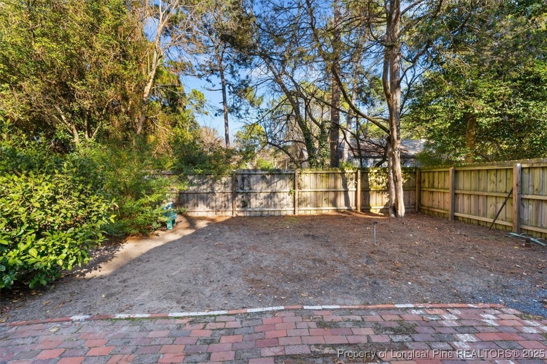 440 Kensington Road Southern Pines, NC 28387 - Photo 7 of 50 a view of a yard with a tree