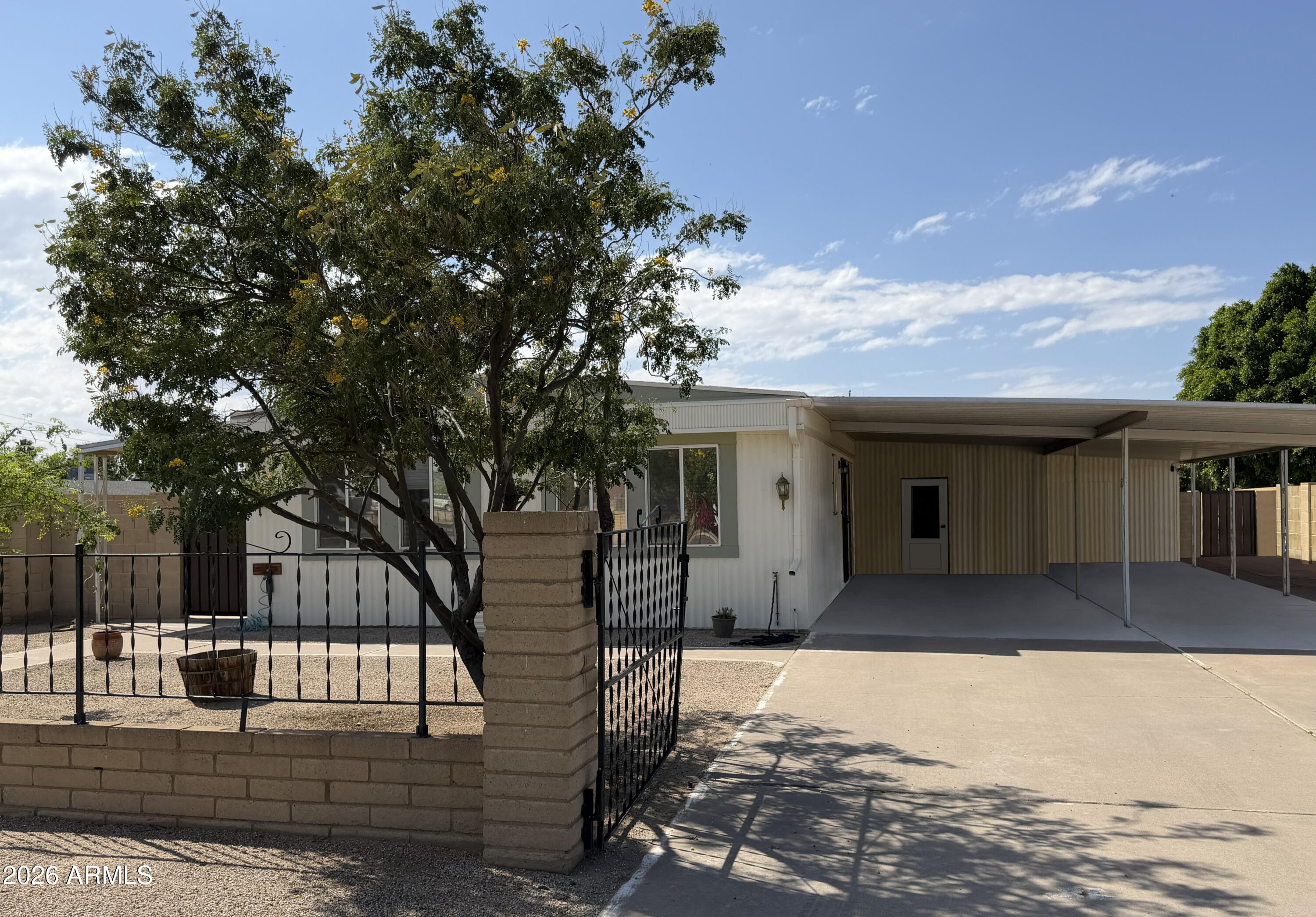 758 South 87th Way Mesa, AZ 85208 - Photo 1 of 24 a front view of a house with a yard