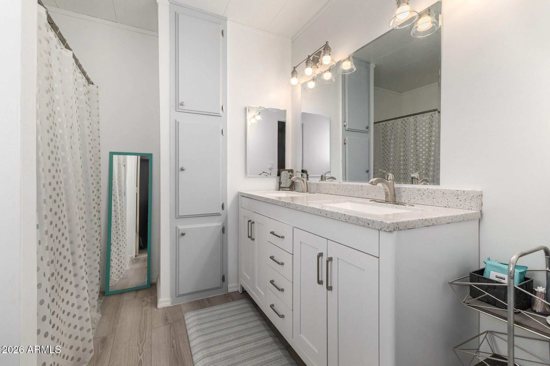 758 South 87th Way Mesa, AZ 85208 - Photo 17 of 24 a bathroom with a double vanity sink and a mirror