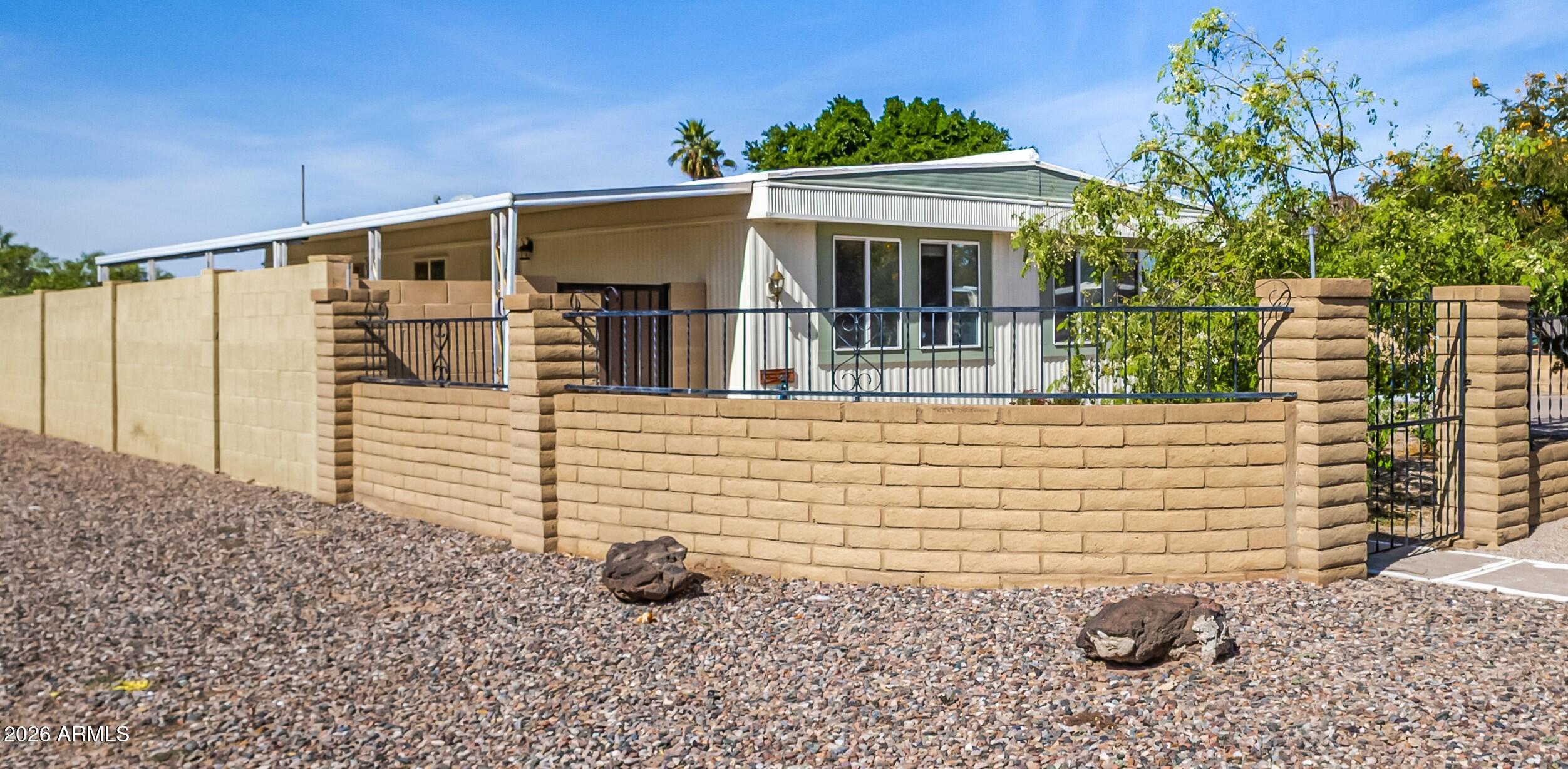 758 South 87th Way Mesa, AZ 85208 - Photo 4 of 24 a front view of a house with a yard