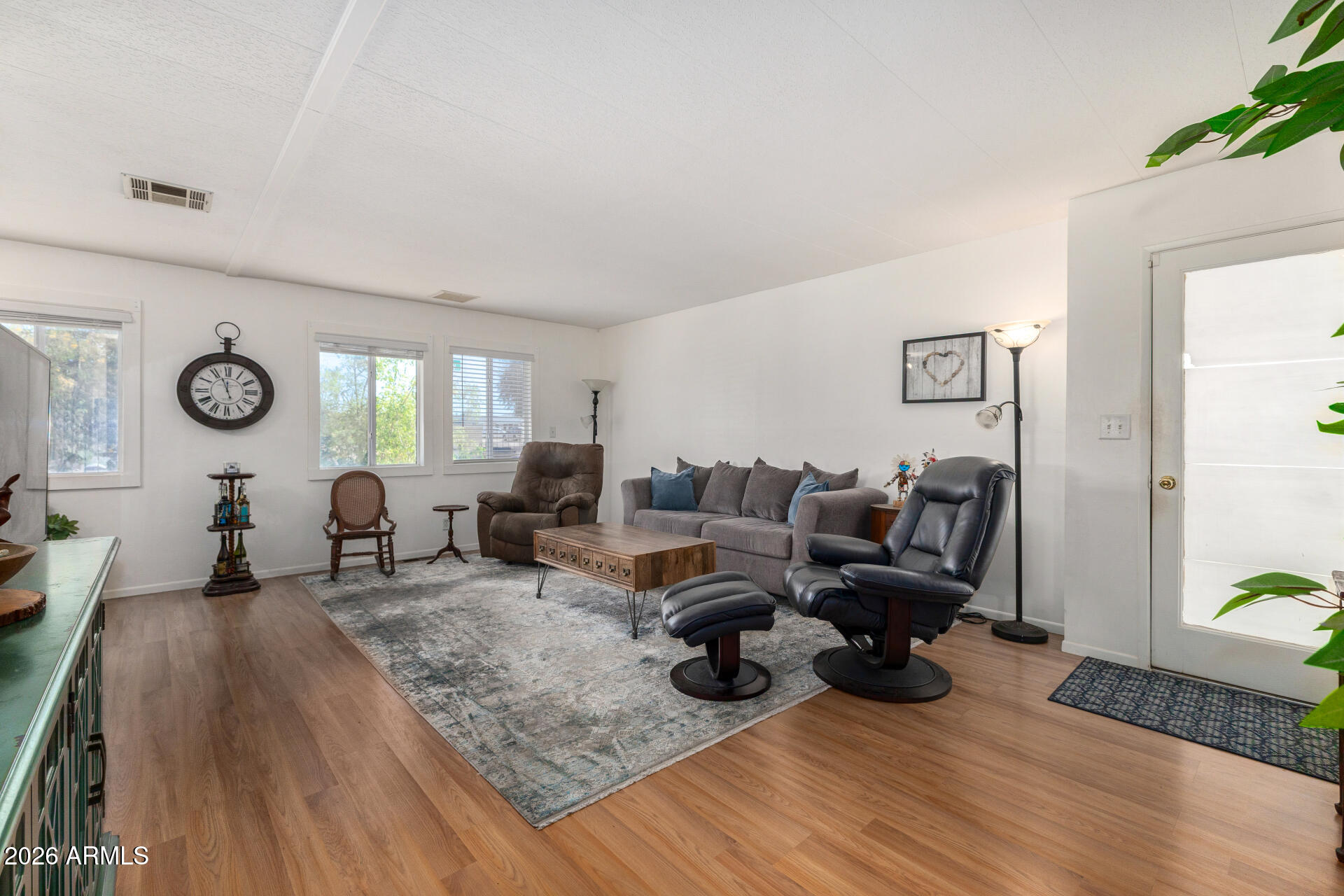 758 South 87th Way Mesa, AZ 85208 - Photo 8 of 24 a living room with furniture and a wooden floor