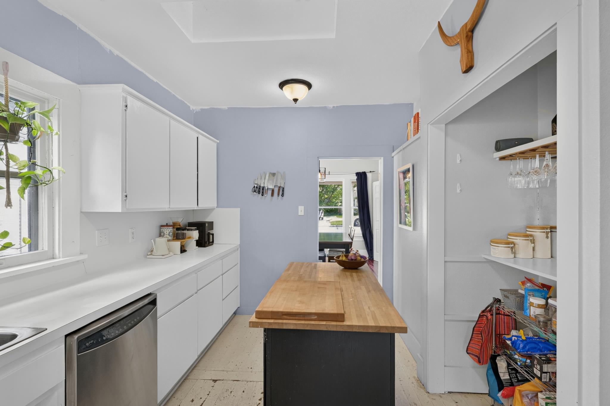 307 East 35th Street, Unit A Austin, TX 78705 - Photo 24 of 40 Functional kitchen with ample cabinetry and a practical butcher block island.