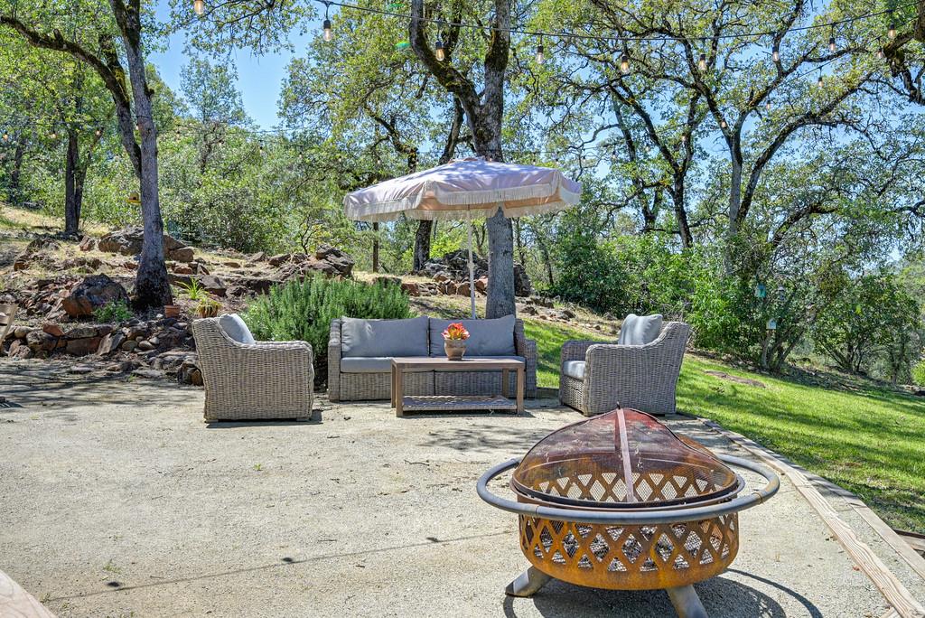 3154 Twin K Road Pilot Hill, CA 95664 - Photo 68 of 89 a patio with a table and a fire pit