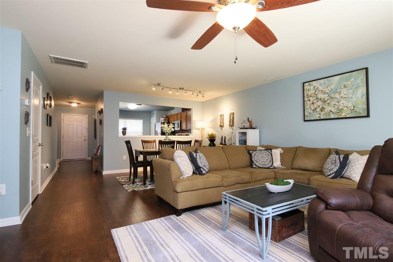 2917 Berkeley Springs Place Raleigh, NC 27616 - Photo 14 of 30 a living room with furniture and wooden floor
