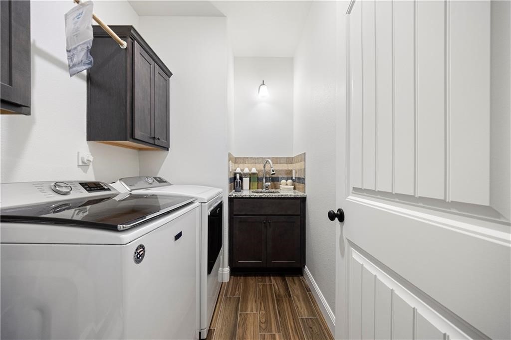 1570 Maryville Loop Beeville, TX 78102 - Photo 17 of 19 a kitchen with a sink and a stove