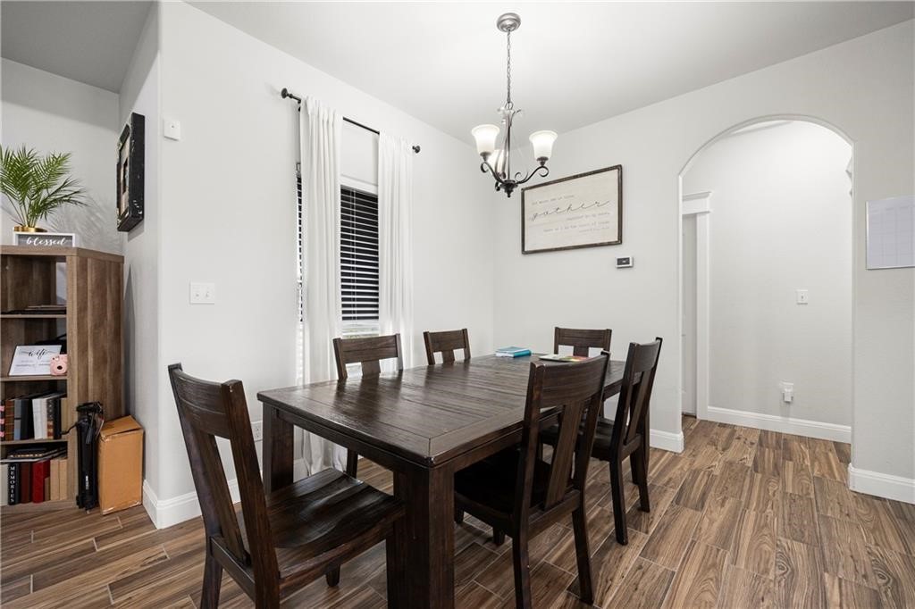 1570 Maryville Loop Beeville, TX 78102 - Photo 5 of 19 a view of a dining room with furniture window and wooden floor