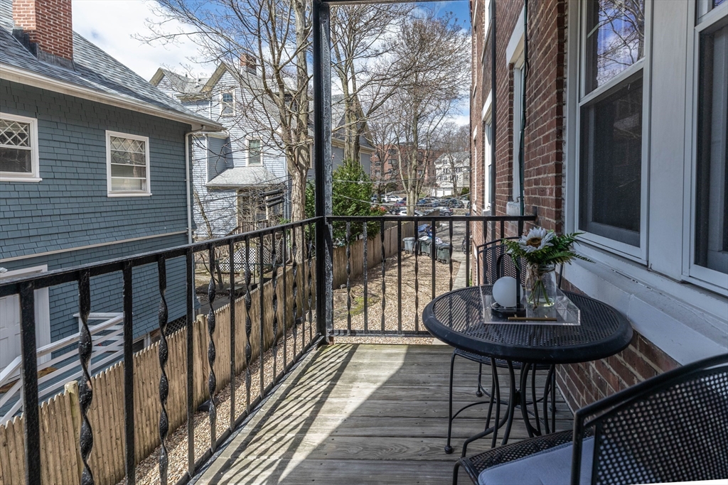 48 Strathmore Road, Unit 26 Boston, MA 02135 - Photo 12 of 15 a view of a balcony with chairs and a potted plant