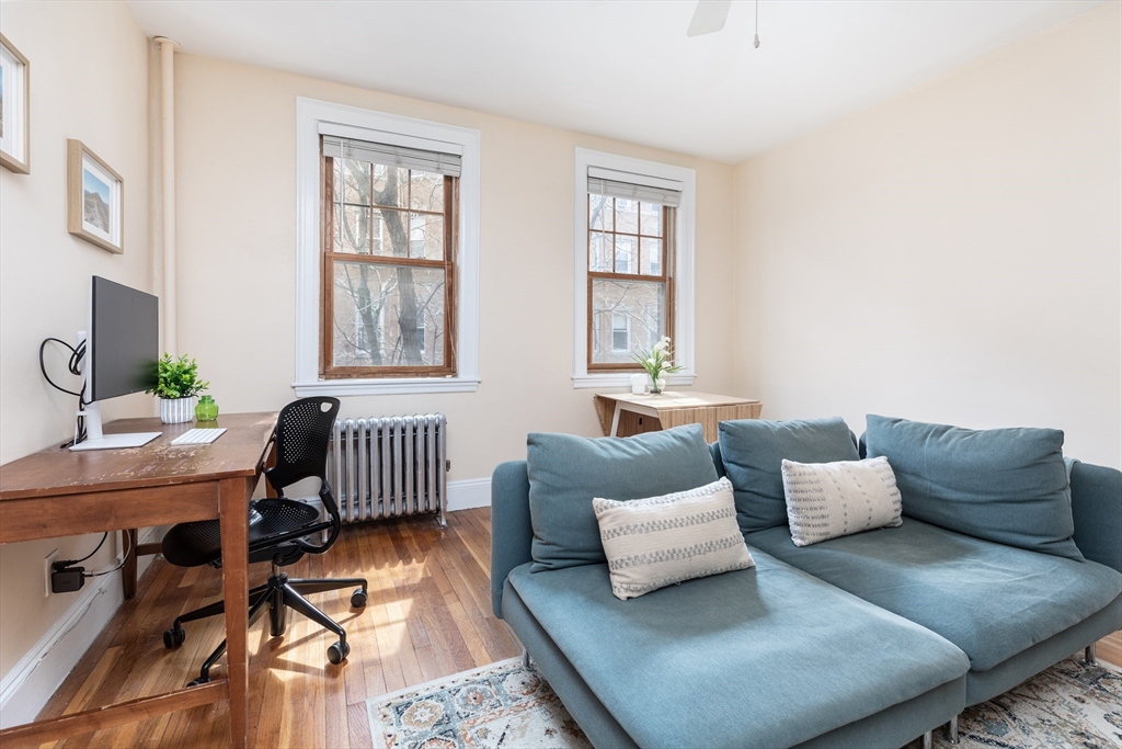 48 Strathmore Road, Unit 26 Boston, MA 02135 - Photo 2 of 15 a living room with furniture and a window