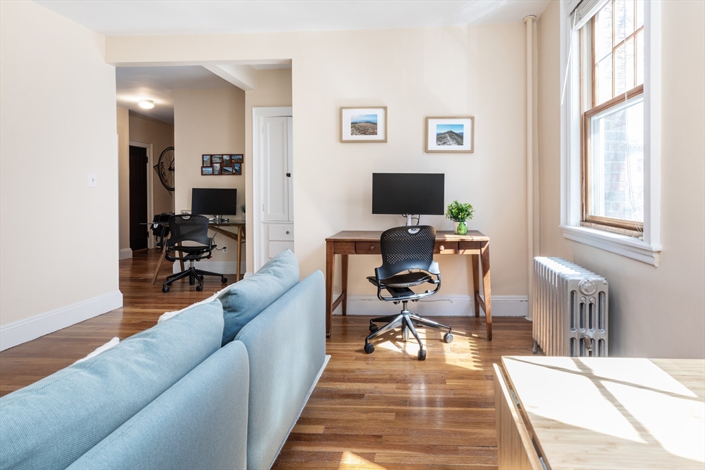 48 Strathmore Road, Unit 26 Boston, MA 02135 - Photo 4 of 15 a living room with furniture a rug and a window
