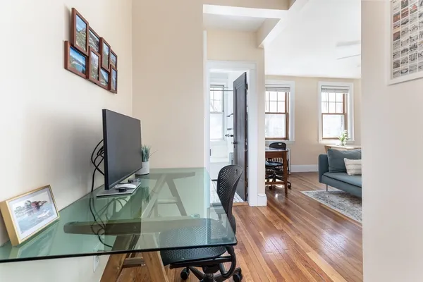 a view of a livingroom with furniture and a flat screen tv