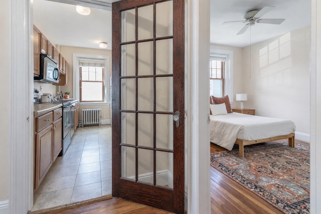 48 Strathmore Road, Unit 26 Boston, MA 02135 - Photo 8 of 15 a view of a bathroom with dual sinks