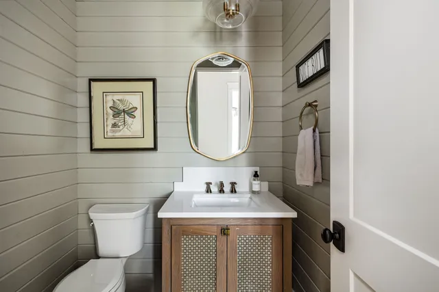 a view of a livingroom with furniture and a window