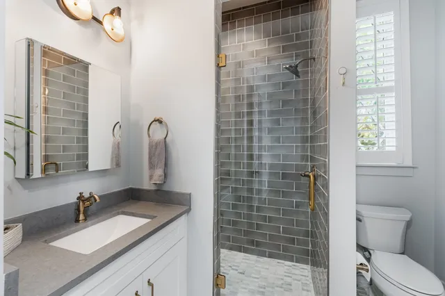 a view of staircase with wooden floor and white walls