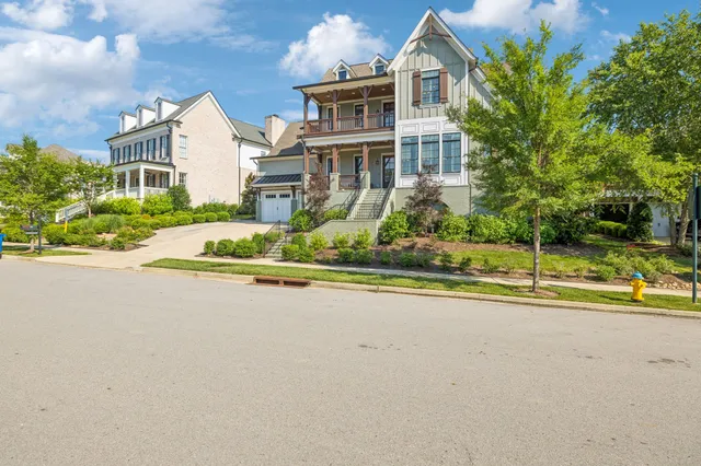 a bathroom with a toilet sink vanity and mirror