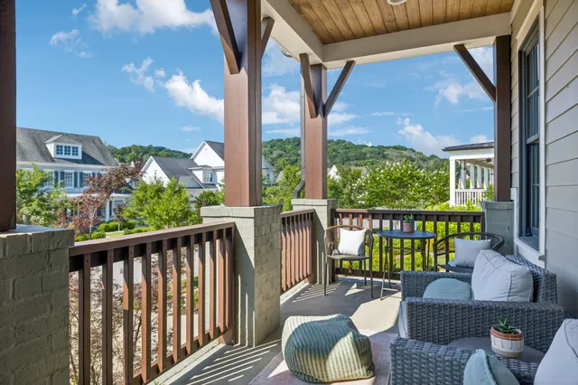 a view of a livingroom with furniture and a flat screen tv