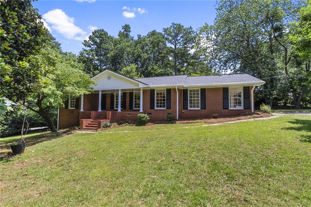 2778 Payton Road Northeast Atlanta, GA 30345 - Photo 1 of 1 Welcome Home! 4 sided brick on basement. Front Porch and Fenced Backyard.