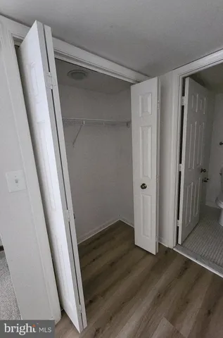 a view of bathroom with mirror