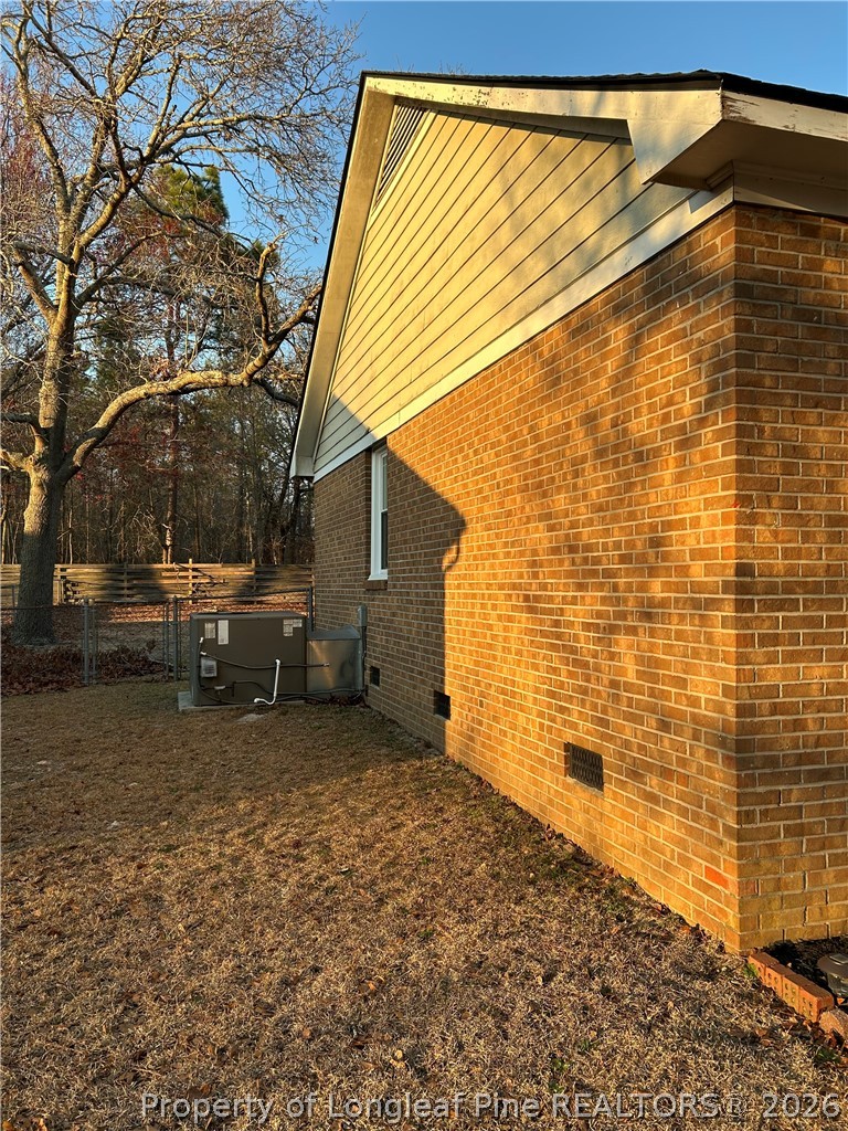 6520 Bagdad Road Fayetteville, NC 28306 - Photo 3 of 6 a view of a backyard with sitting area