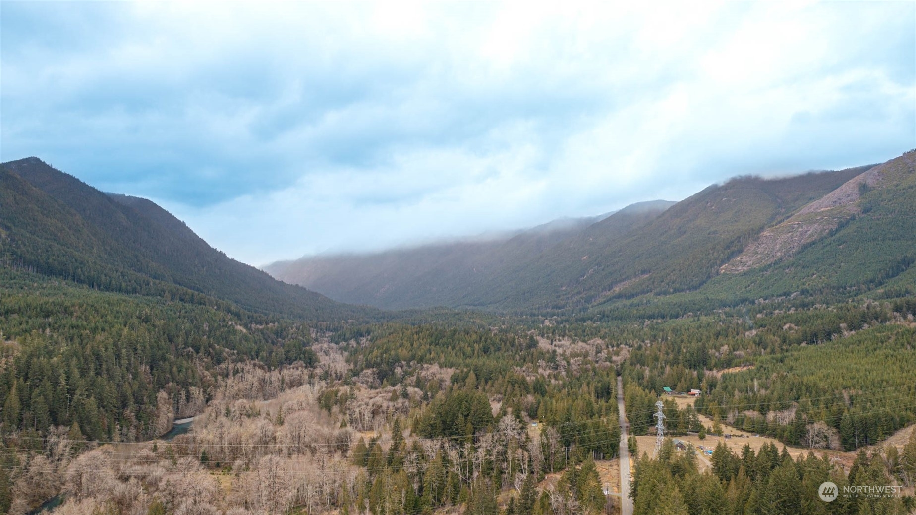 0 Duckabush Road Brinnon, WA 98320 - Photo 11 of 13 a view of a yard with mountains in the background
