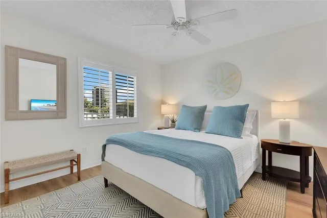 a bedroom with bed and a window