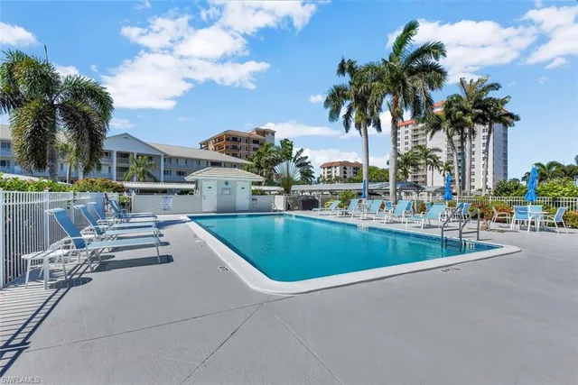 a view of a patio with swimming pool