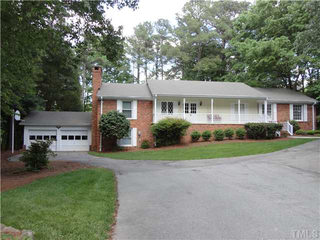 8804 Katharina Court Raleigh, NC 27613 - Photo 1 of 22 a front view of a house with a yard and trees