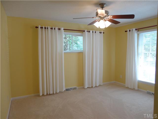 8804 Katharina Court Raleigh, NC 27613 - Photo 13 of 22 a view of a bathroom with a window and a chandelier