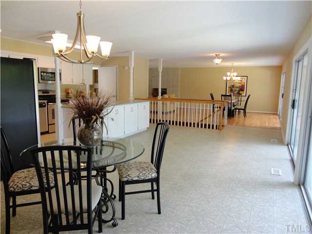 8804 Katharina Court Raleigh, NC 27613 - Photo 18 of 22 a view of a dining room with furniture and a chandelier