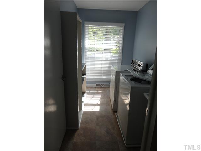 8804 Katharina Court Raleigh, NC 27613 - Photo 20 of 22 a room with a door open to a room