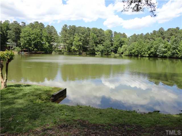 8804 Katharina Court Raleigh, NC 27613 - Photo 2 of 22 a view of a lake with houses in the back
