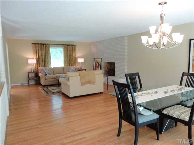 8804 Katharina Court Raleigh, NC 27613 - Photo 6 of 22 a view of a dining room with furniture wooden floor and chandelier