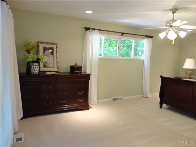 8804 Katharina Court Raleigh, NC 27613 - Photo 9 of 22 a room with a dresser and a window