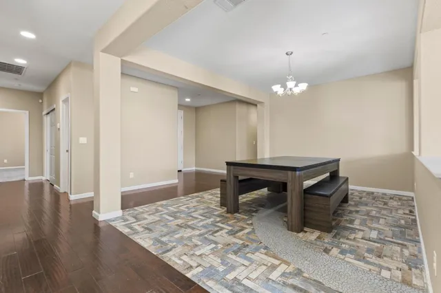 a room with a table and chairs