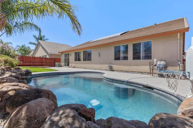 a view of backyard with seating space