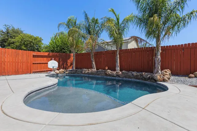 a view of a backyard with a tub