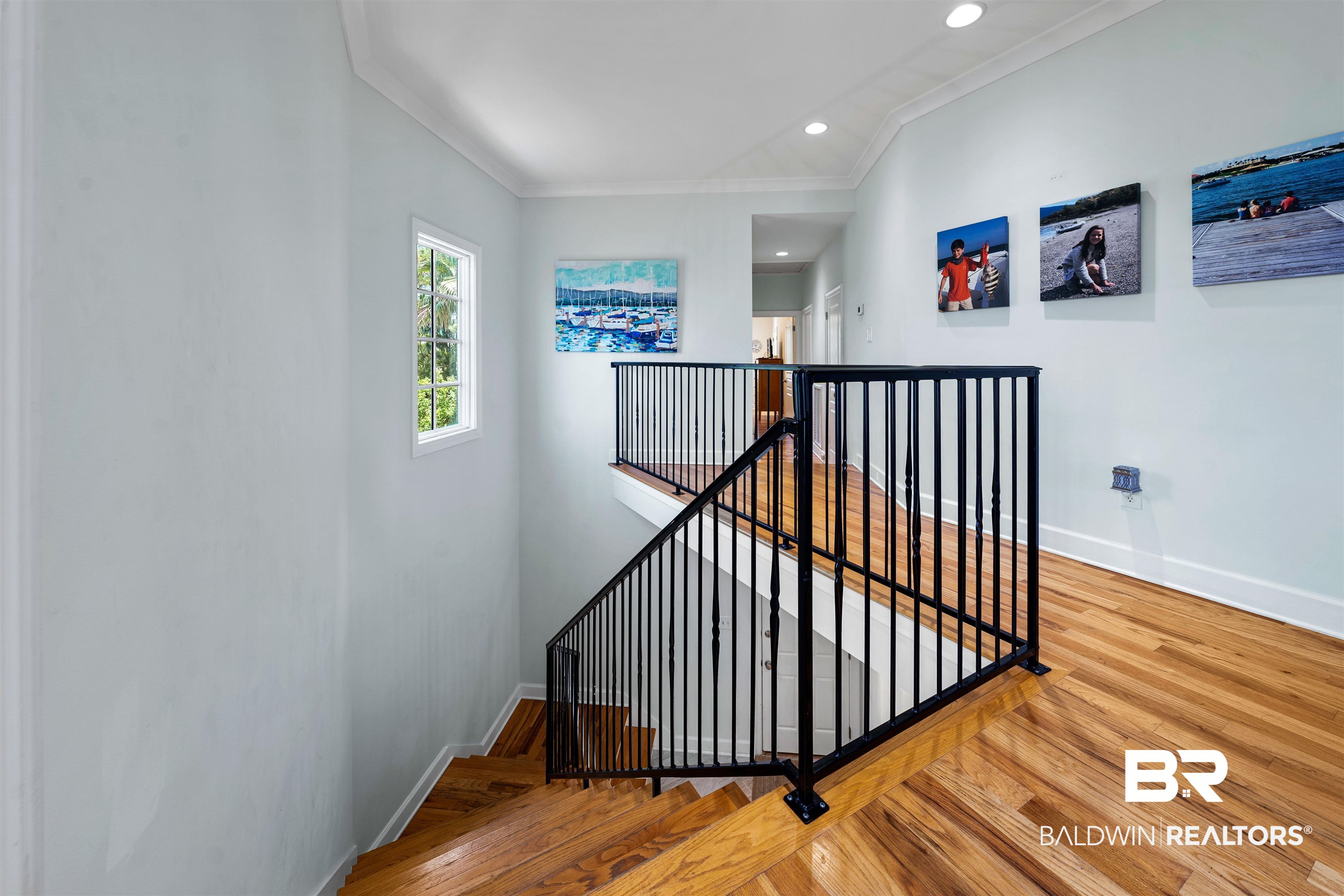 3434 Mariner Circle Orange Beach, AL 36561 - Photo 13 of 38 Stairway featuring crown molding and light wood-type flooring