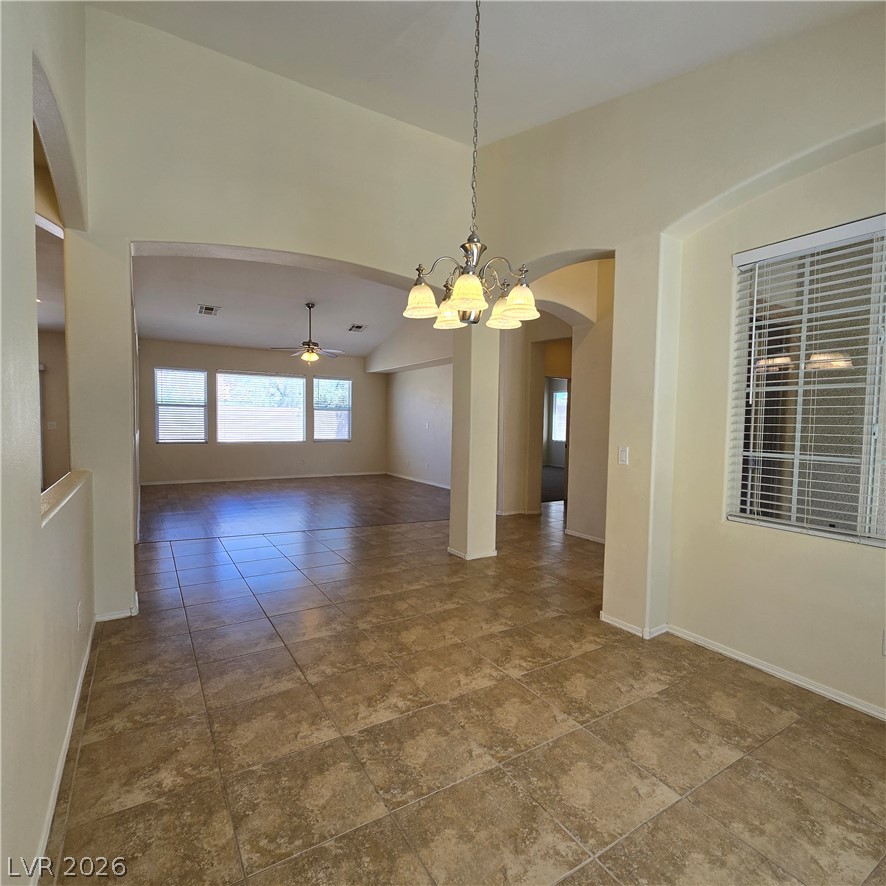 9234 Kingston Road Henderson, NV 89074 - Photo 37 of 38 An open floorplan with tile flooring and high ceilings, ideal for flexible living and dining.