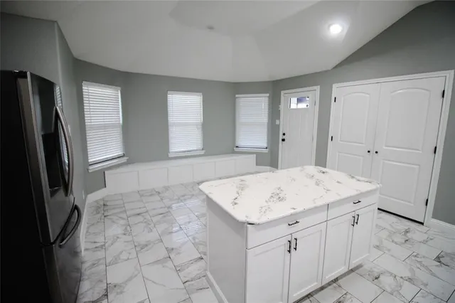 a bathroom with a sink a vanity and a mirror