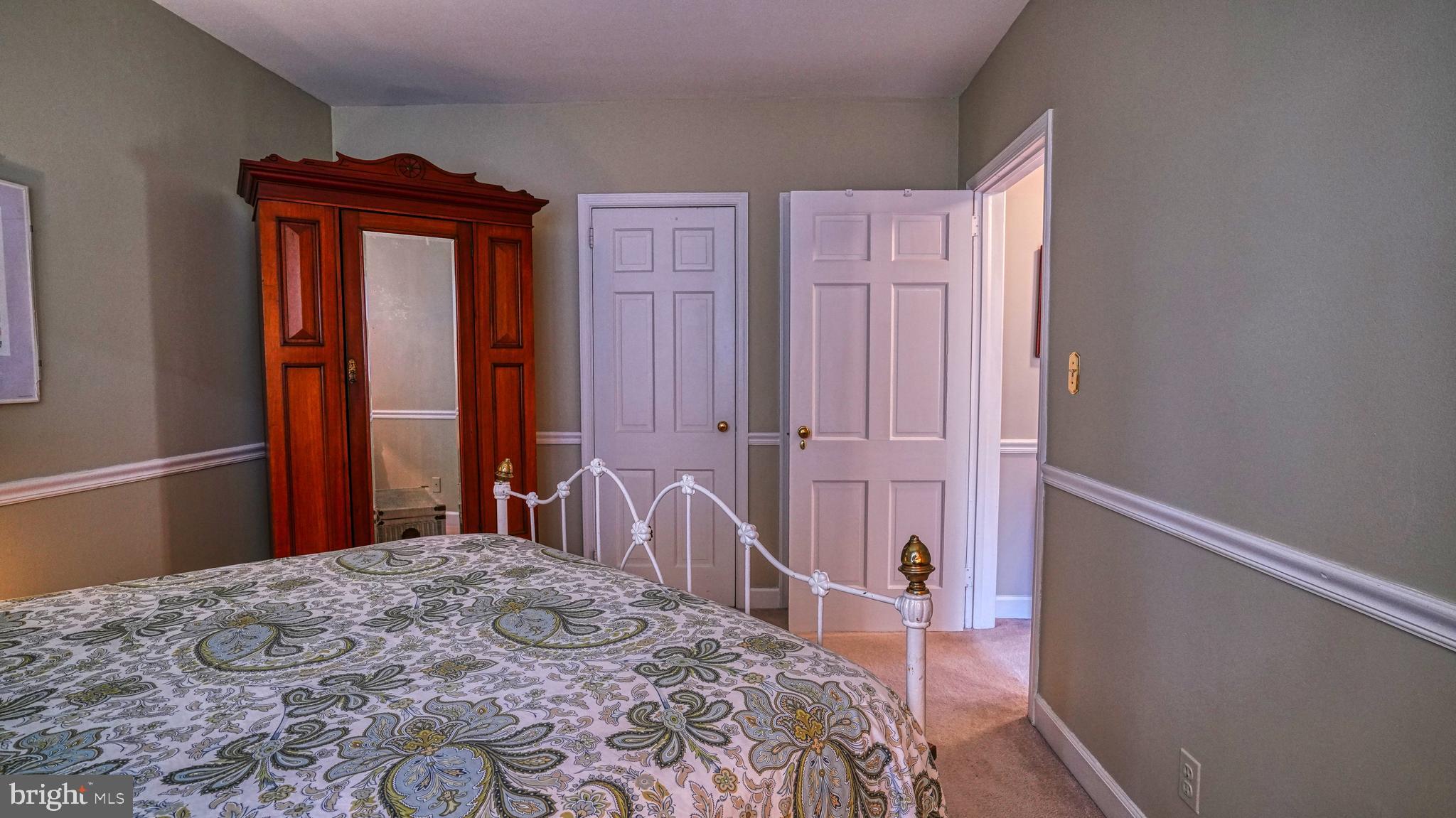 1107 North Pitt Street, Unit 2A Alexandria, VA 22314 - Photo 25 of 32 a bedroom with a bed and a dresser