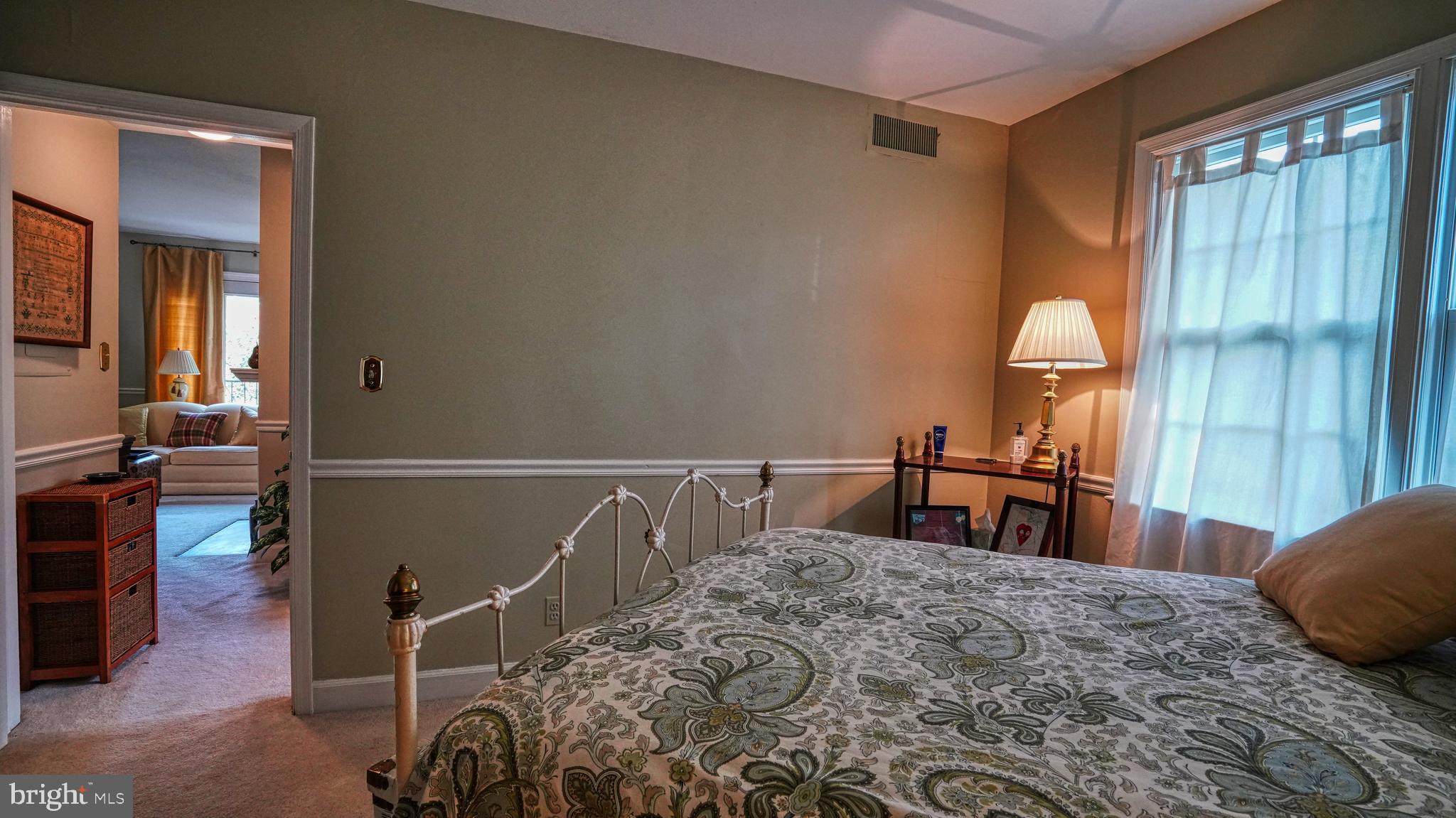 1107 North Pitt Street, Unit 2A Alexandria, VA 22314 - Photo 26 of 32 a bed room with a bed and a chair