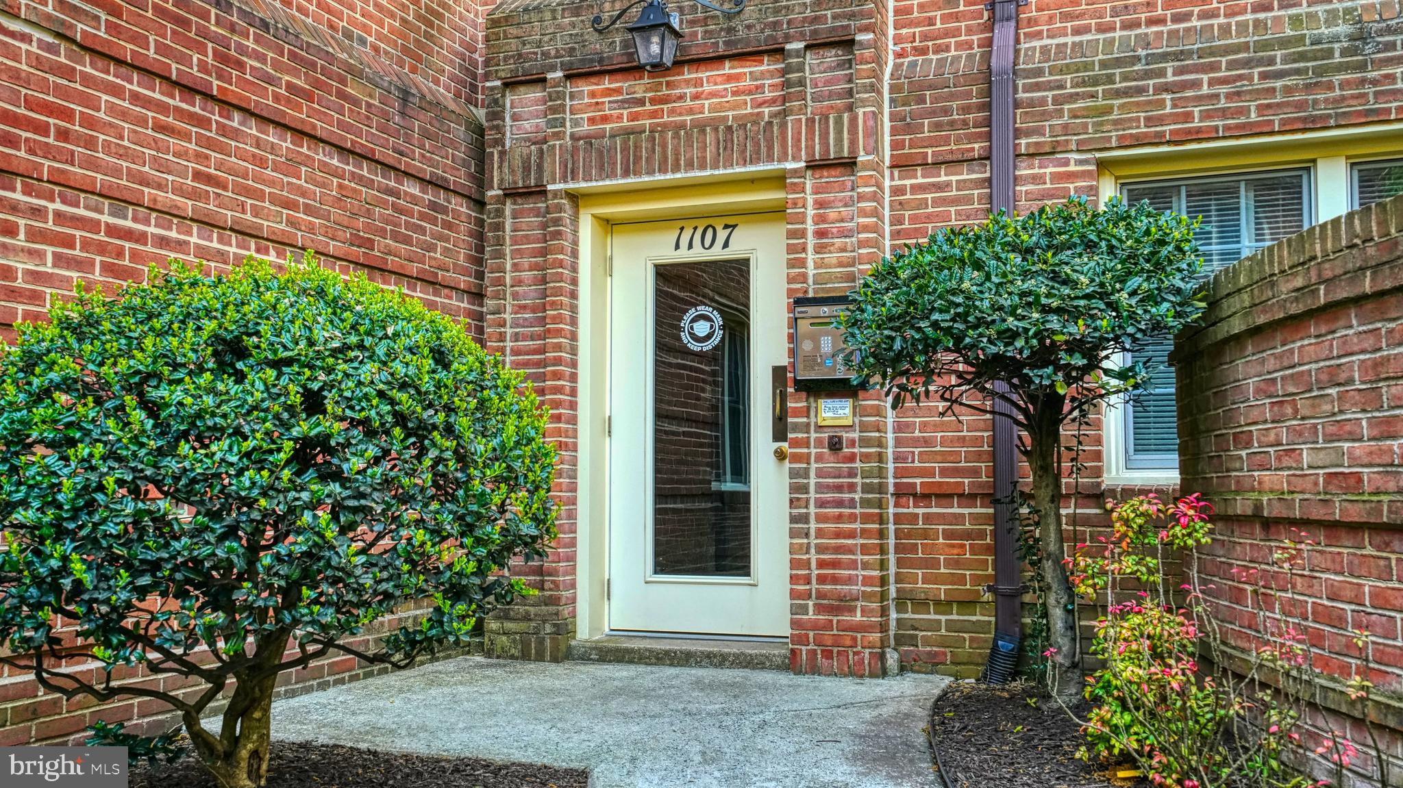 1107 North Pitt Street, Unit 2A Alexandria, VA 22314 - Photo 29 of 32 a front view of a house with plants