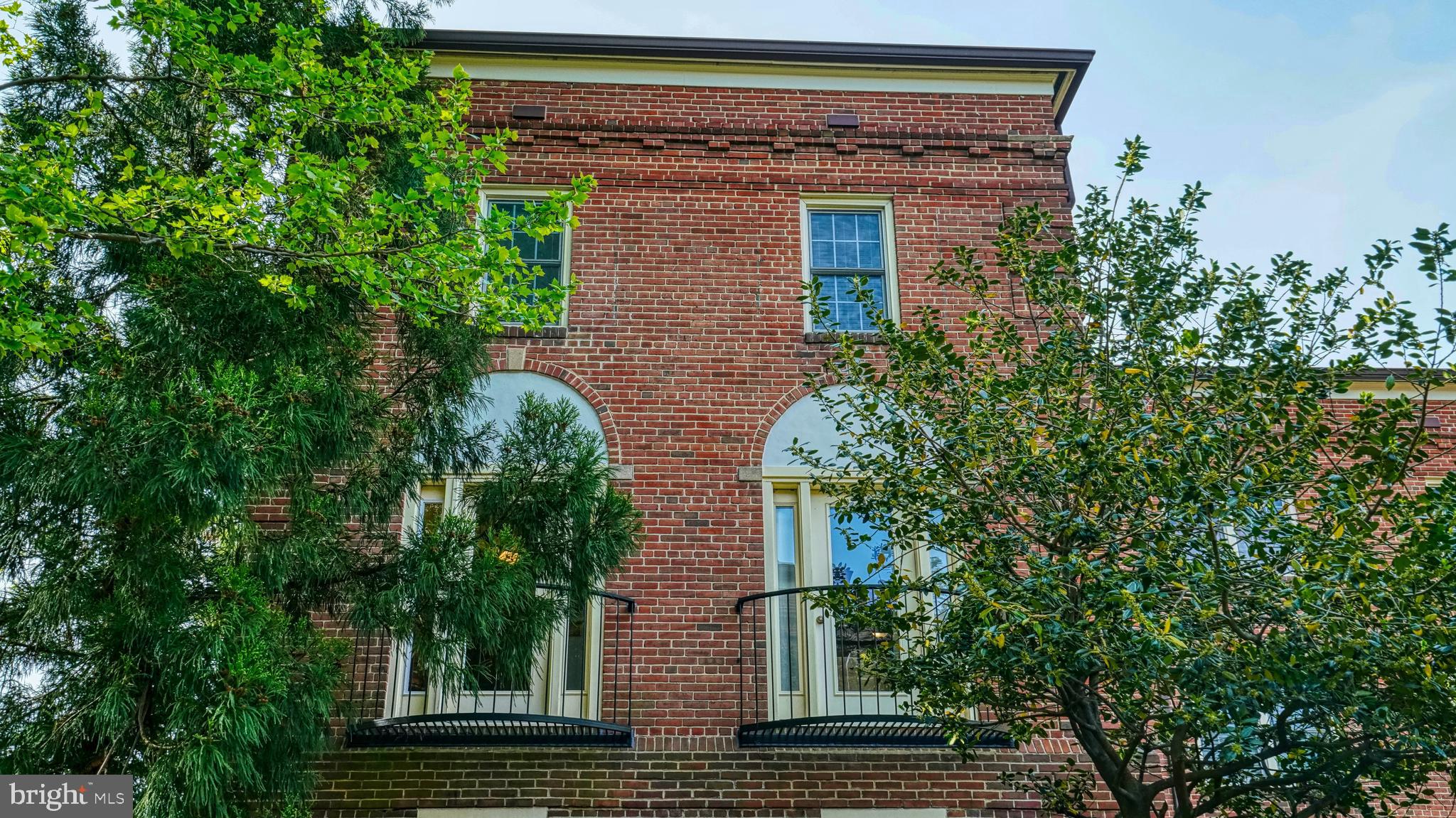 1107 North Pitt Street, Unit 2A Alexandria, VA 22314 - Photo 31 of 32 front view of a house with a tree